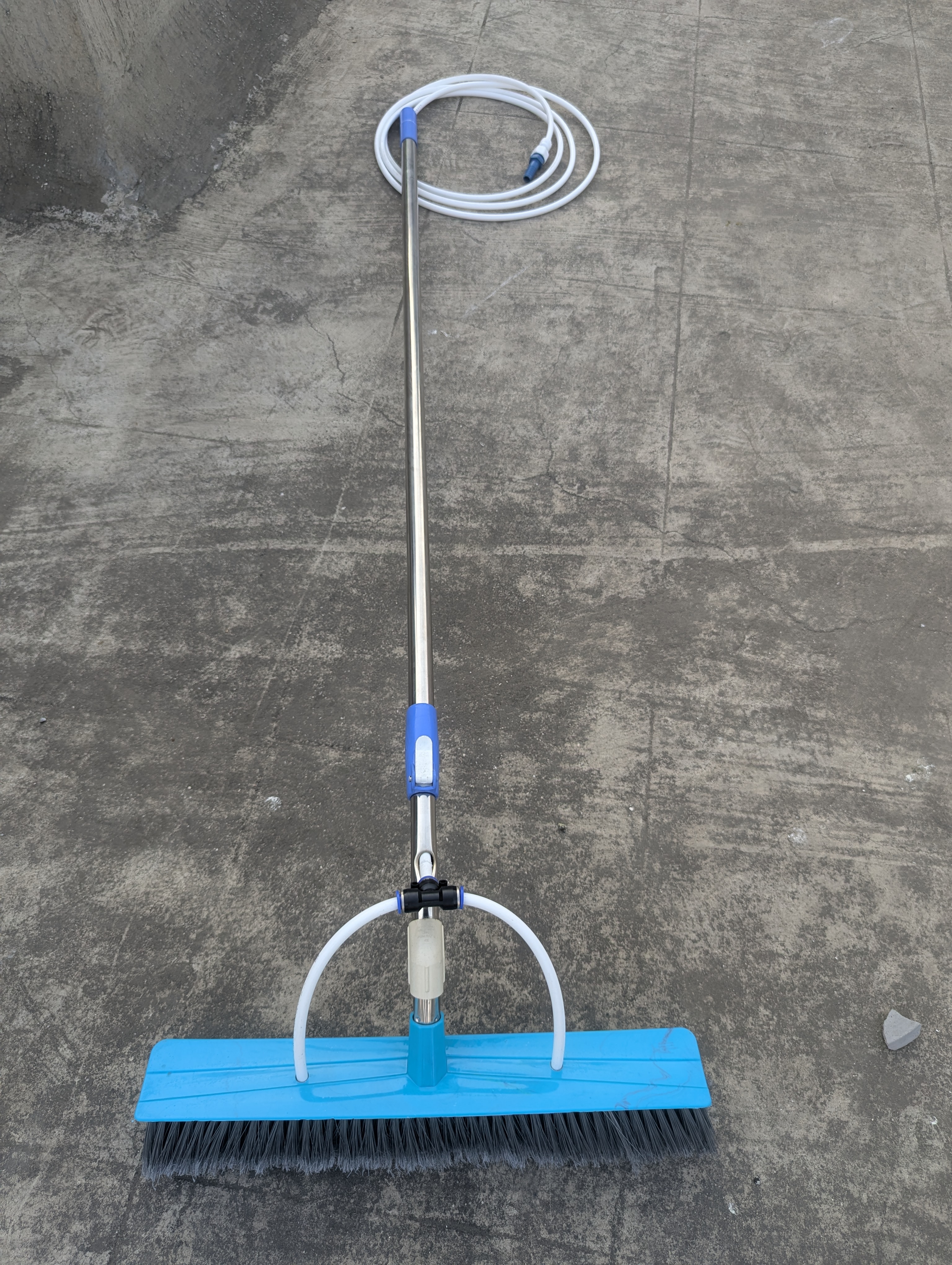 Brush with water hose
